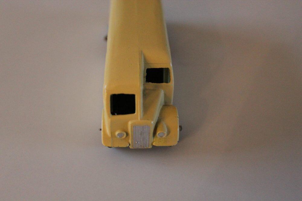 Vintage Dinky Toys 029e half cab bus model, yellow diecast toy vehicle for collectors.