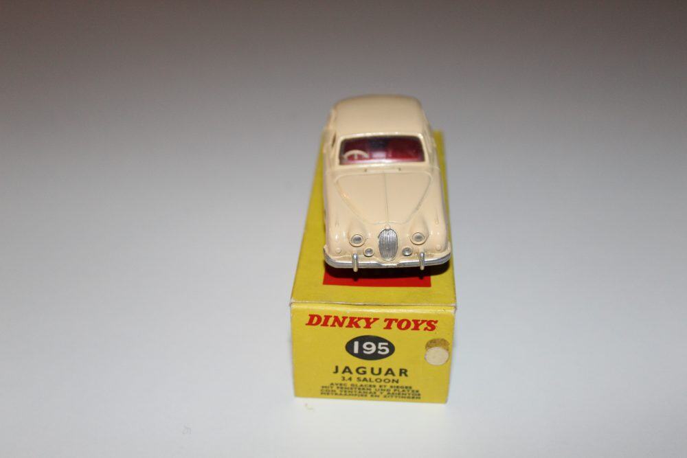 Vintage Dinky Toys 195 Jaguar 3.4 Saloon model on yellow box, collectible diecast car.