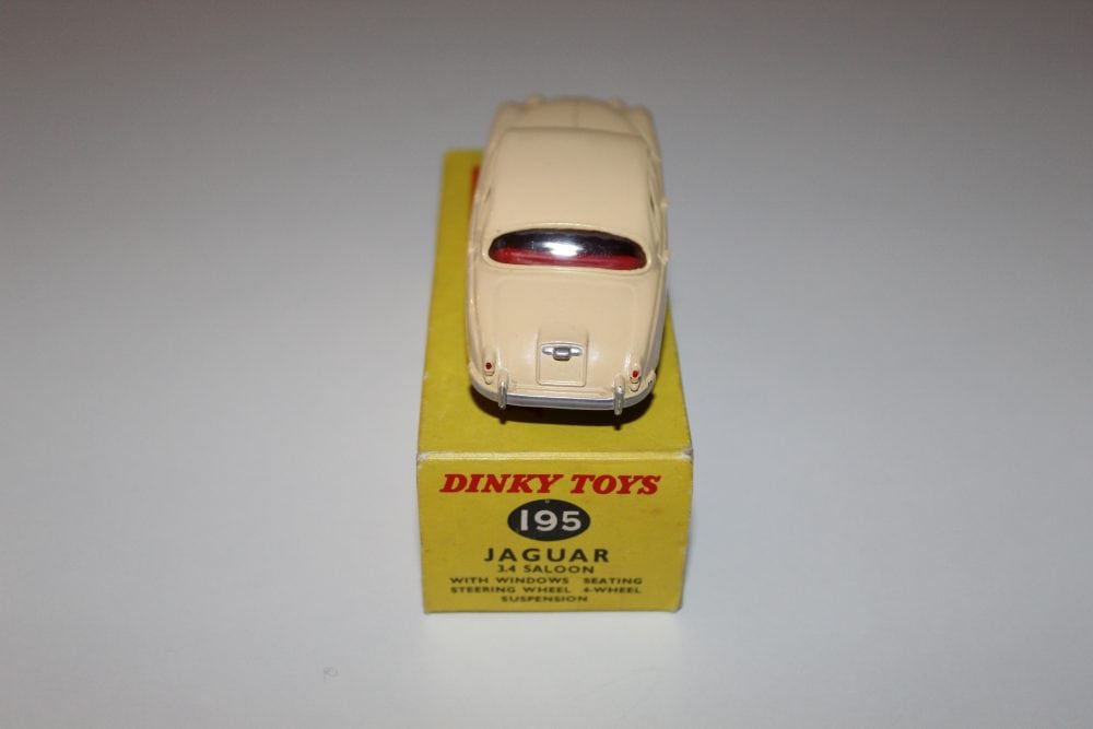 Dinky Toys 195 Jaguar 3.4 Saloon model on yellow display box, vintage diecast car.