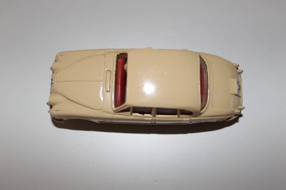 Detailed diecast model of a 195 Jaguar 3.4 Saloon car, beige colour with red interior.