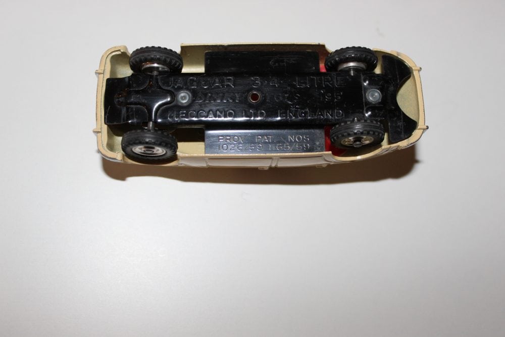 Dinky Toys 195 Jaguar 3.4 Saloon diecast model car, vintage collectible toy, black and cream color,.