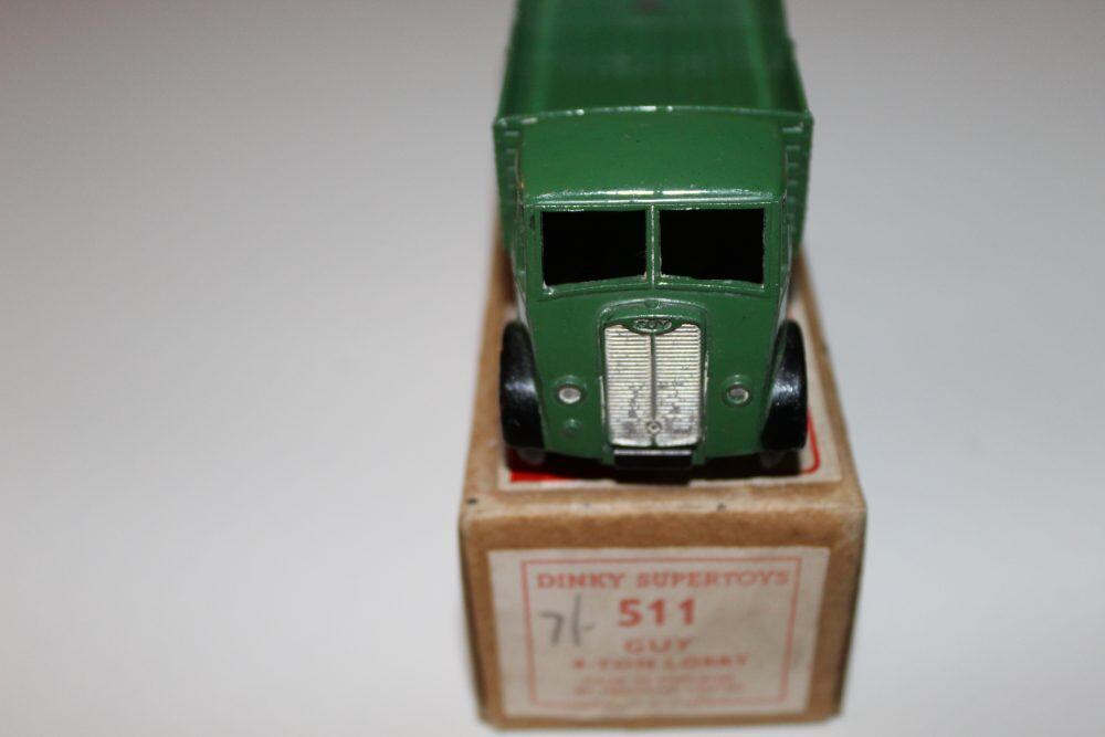 Dinky Toys 511 Guy 4-Ton Lorry model on its original box, vintage diecast vehicle.