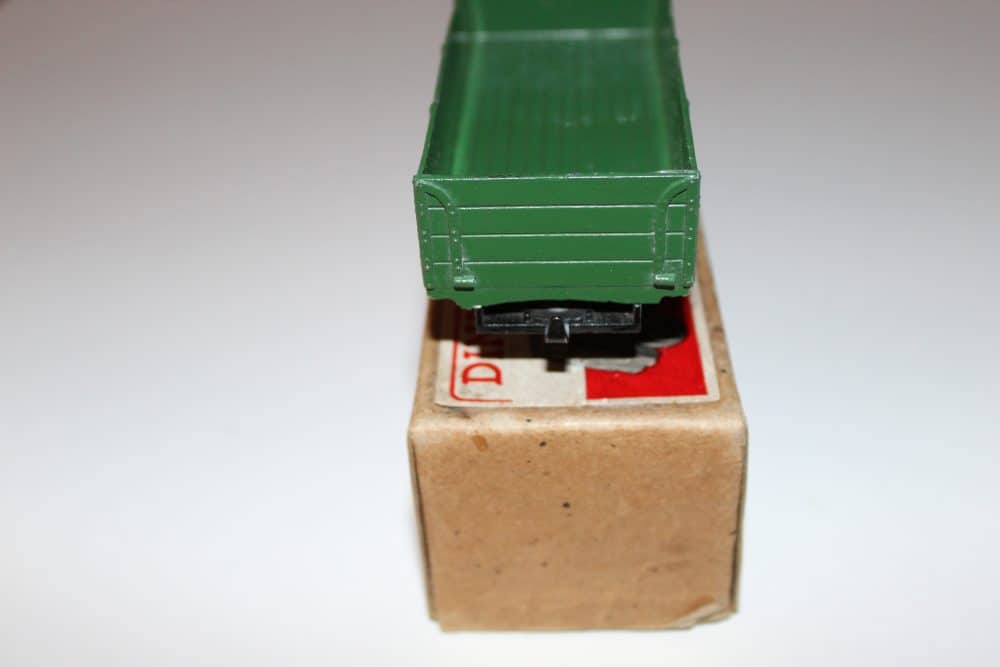 Detailed model of a green Dinky Toys 511 Guy 4-Ton Lorry on a small cardboard box.