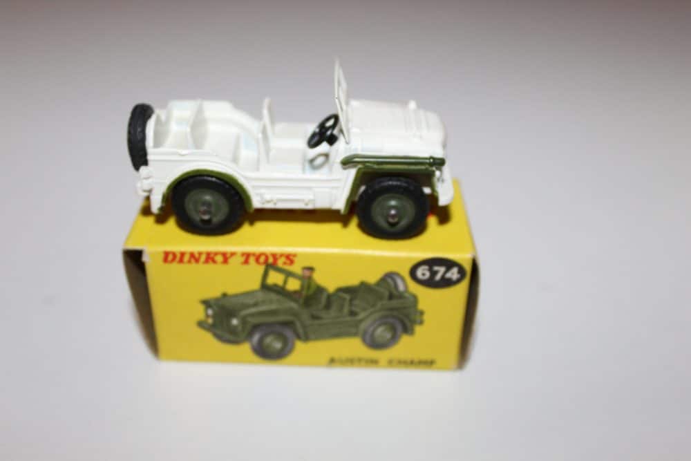 Vintage Dinky Toys 674 'UN' Austin Champ diecast model on yellow box.