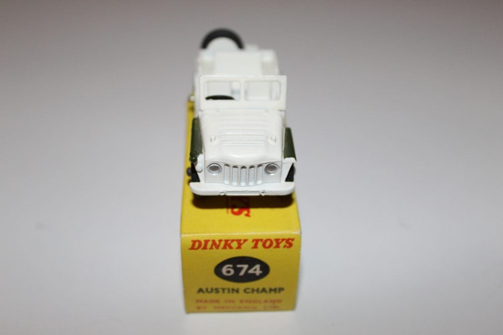 Diecast model of Dinky Toys 674 Austin Champ military vehicle on display.