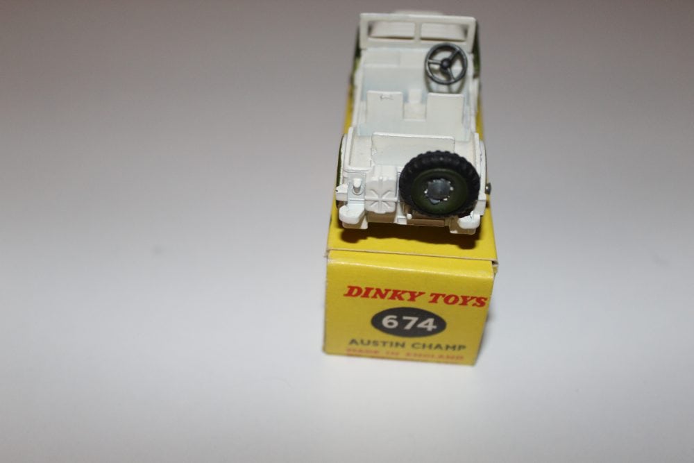 Dinky Toys 674 'UN' Austin Champ diecast model on yellow box, vintage military vehicle.