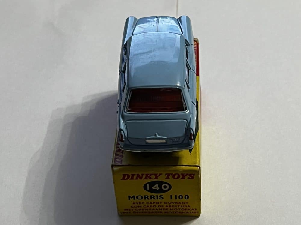 Vintage Dinky Toys Triumph 2000 model car on yellow display box.