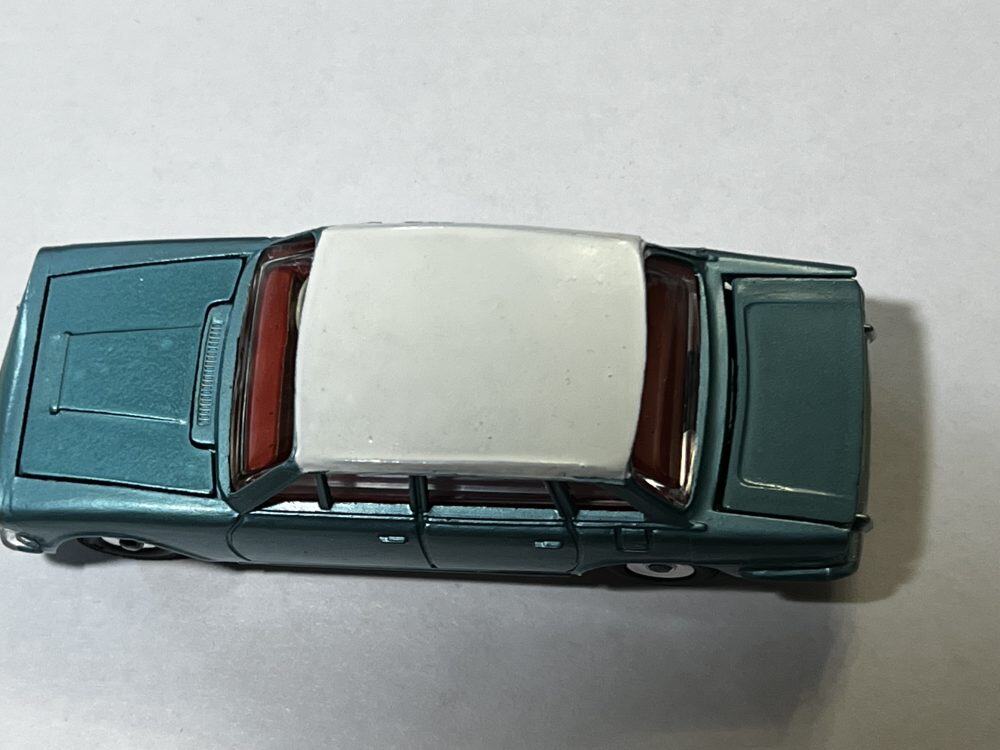 Dinky Toys 135 Triumph 2000 vintage diecast model car, detailed miniature collectible.