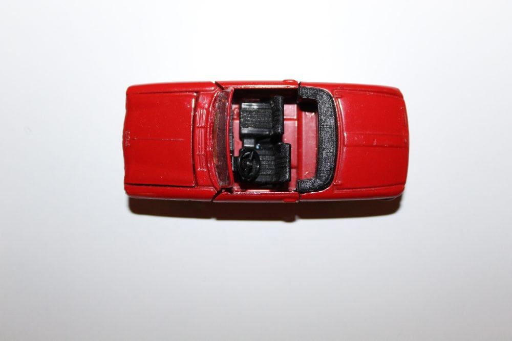 Vintage Dinky 511 Peugeot Cabriolet diecast toy car, red, top view.