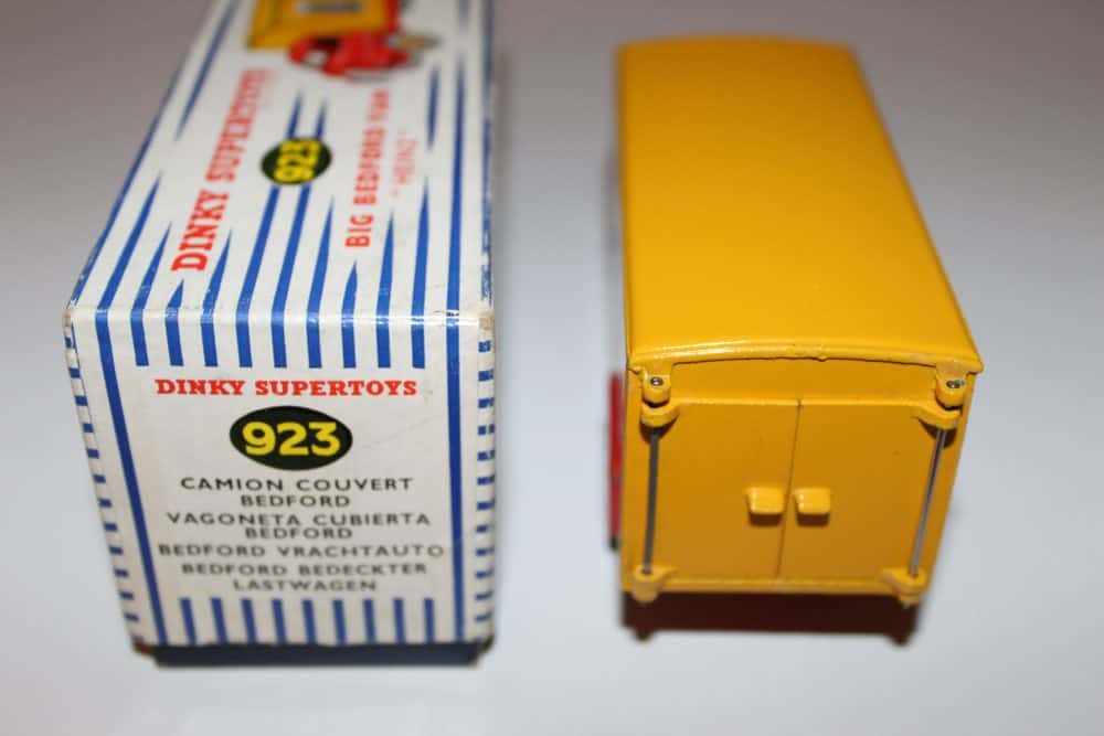 Vintage Dinky Toys Bedford lorry model with yellow cargo box, collectible diecast vehicle.