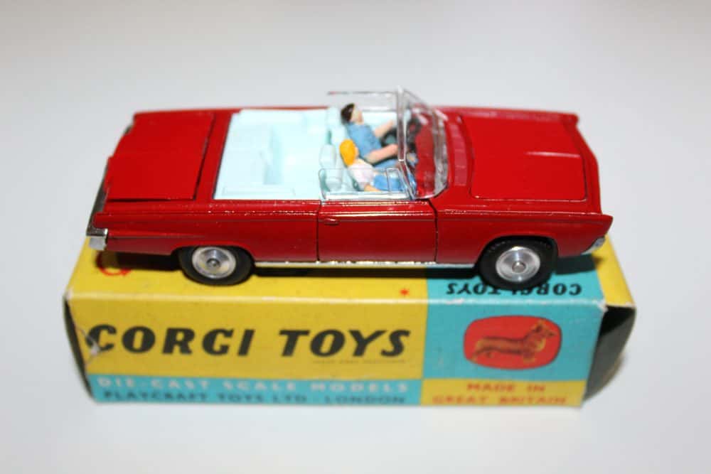 Vintage Dinky Toys 130 Ford Consul Corsair model car with driver, on Corgi Toys box.