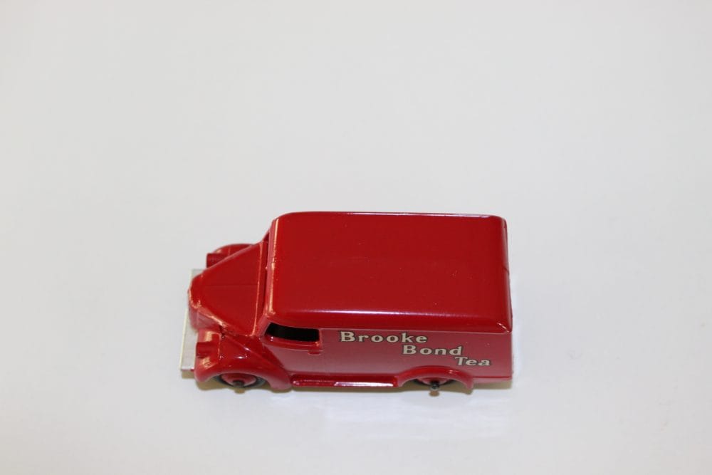 Vintage Brooke Bond Tea van model, Dinky Toys 455 Trojan, red collectible diecast vehicle.