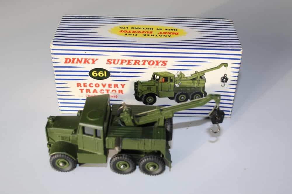 Detailed Corgi Land-Rover toy with elephant and cage trailer, vintage diecast model for collectors.