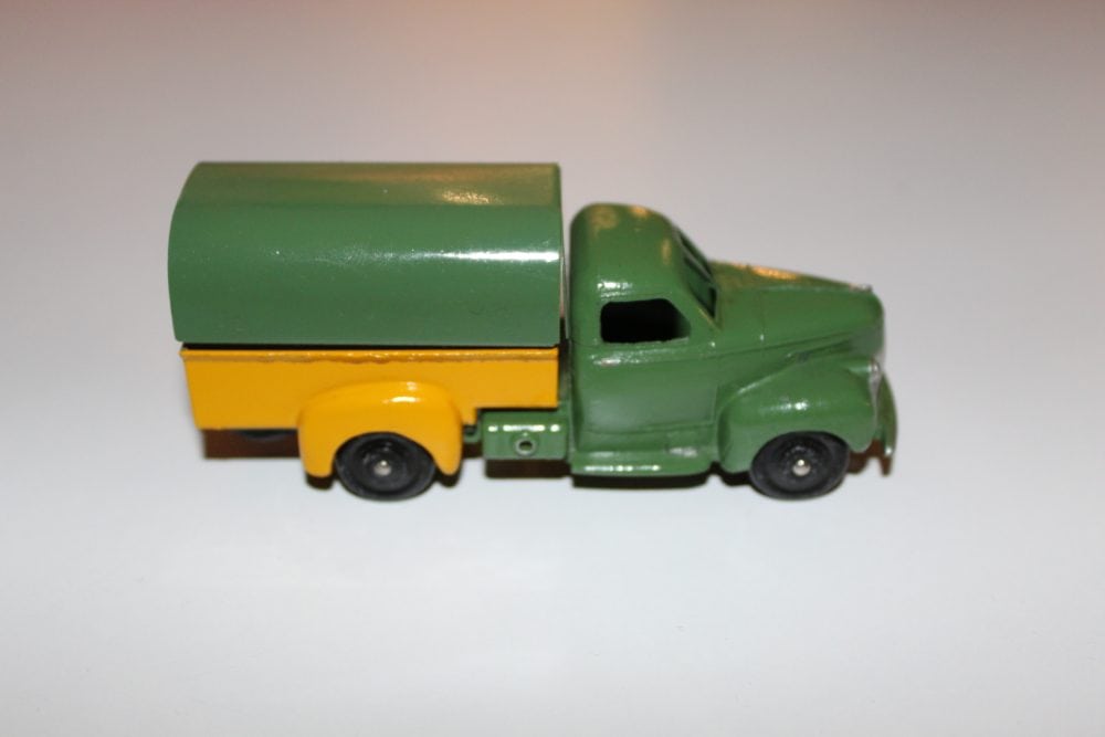 Vintage Dinky Ford covered wagon toy model in green and yellow, SNCF themed.