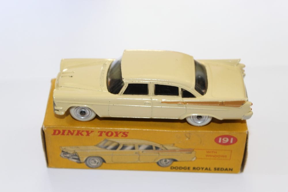 Dinky Toys 191 Dodge Royal Sedan diecast model on original box, vintage collectible car.