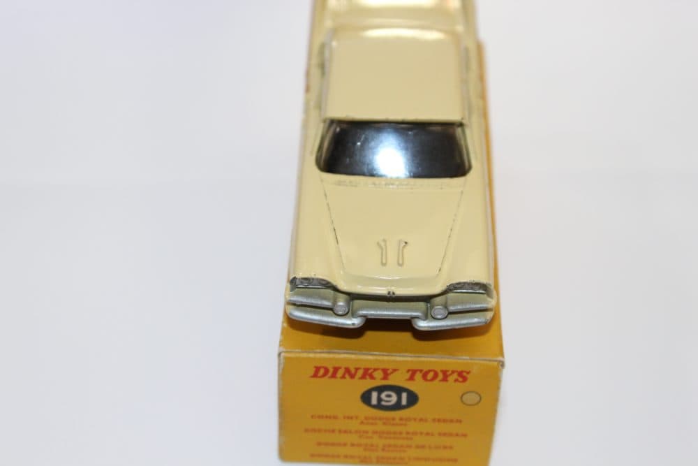 Dinky Toys 191 Dodge Royal Sedan diecast model on original box, collectible vintage toy.