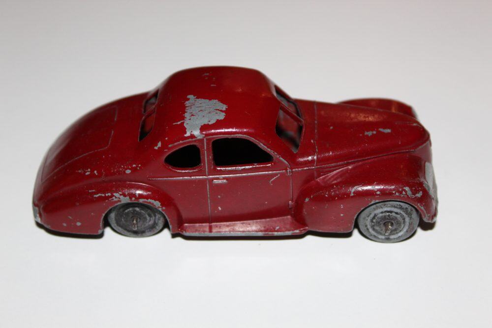 Vintage Dinky Toys 024O Studebaker State Commander model car, early post-war collectible.