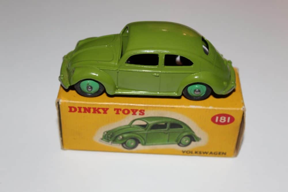 Vintage Dinky Toys 181 Volkswagen Beetle model car on box.