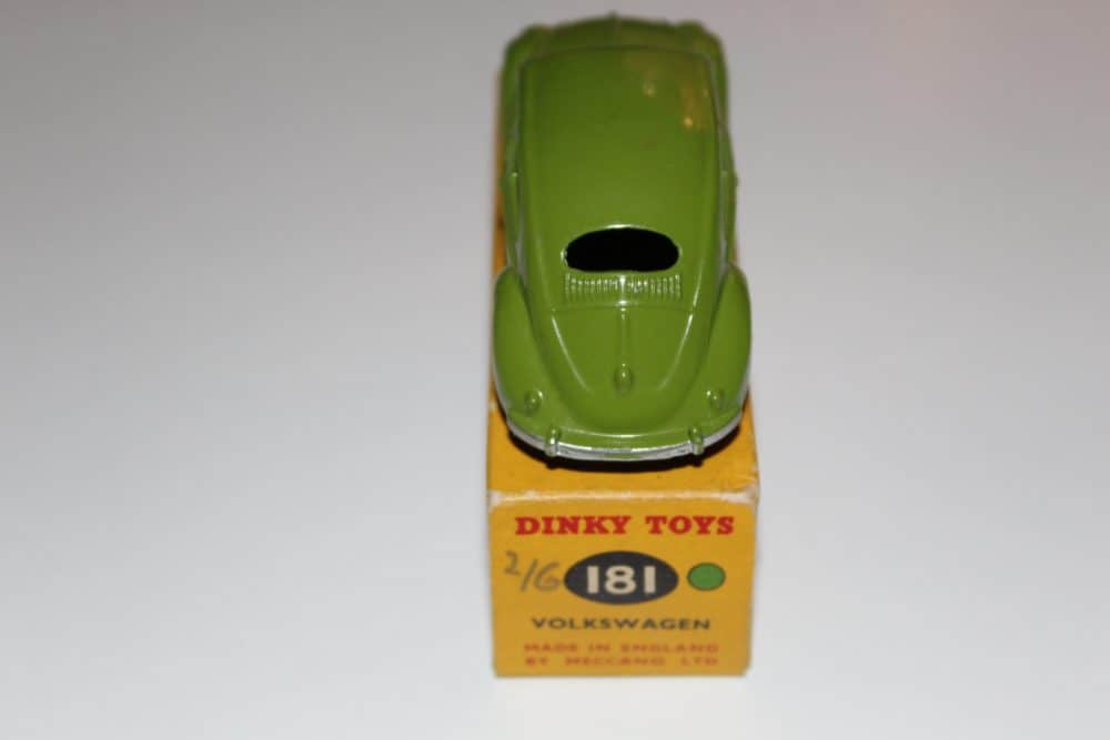Vintage Dinky Toys 181 Volkswagen Beetle model car in green with original packaging.