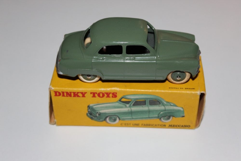 Vintage Dinky Toys French Simca 9 'Aronde' diecast car on box.