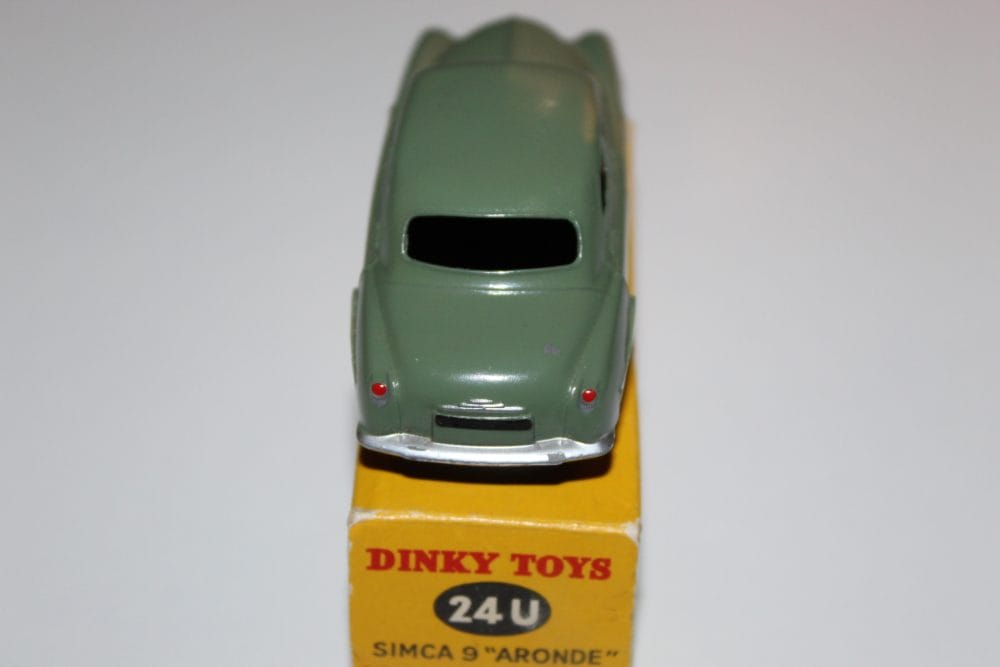 Detailed green Dinky Toys Simca 9 'Aronde' miniature on display.