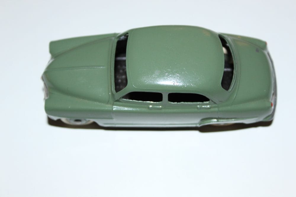 Vintage green Dinky Toys Simca 9 'Aronde' diecast car for collectors.
