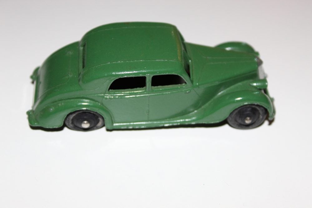 Vintage green diecast model of a Riley Saloon car for collectors.