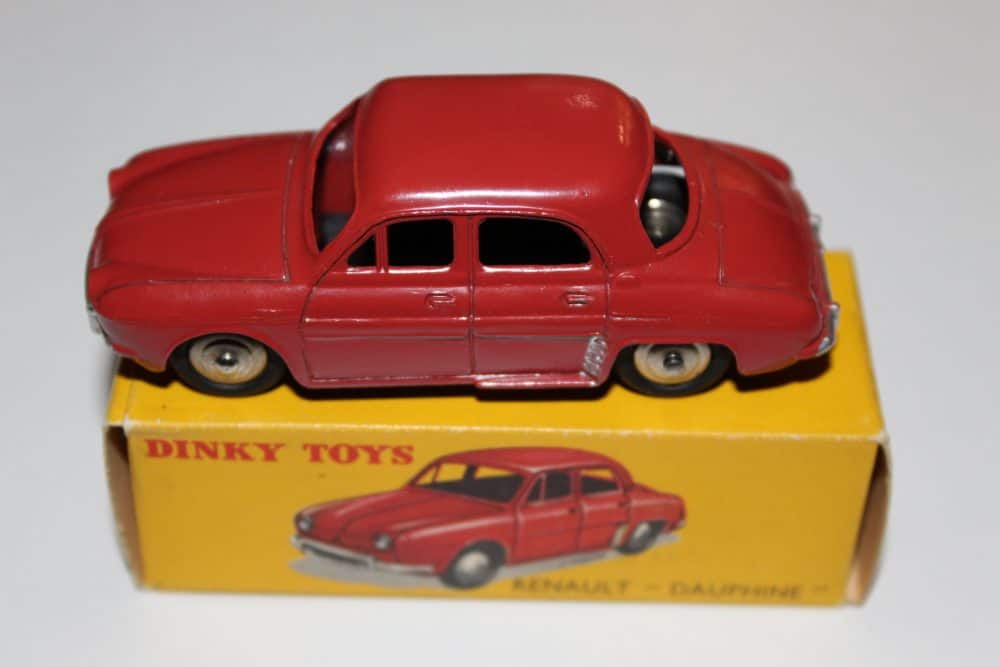 Vintage Dinky Toys 24E Renault Dauphine diecast model on yellow box.