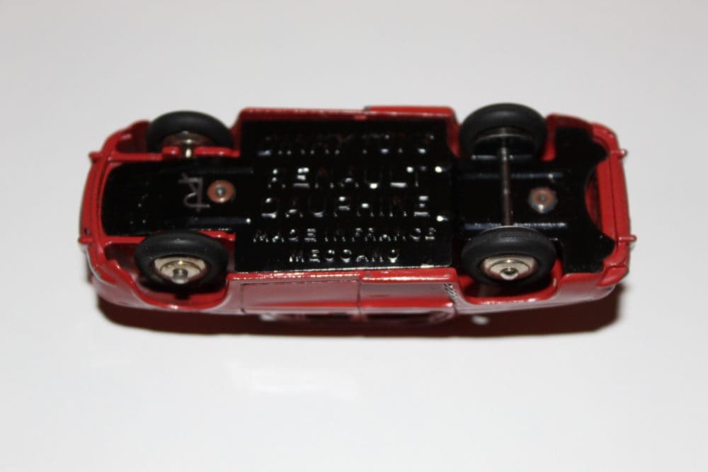 Vintage French Dinky Toys 24E Renault Dauphine diecast model car, underside view.