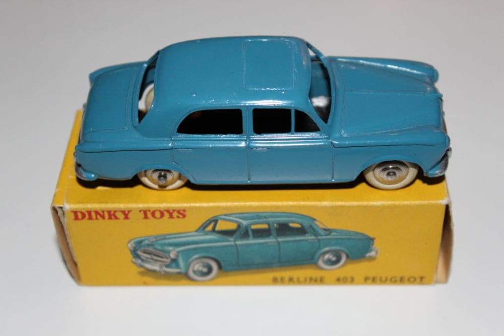 Vintage Dinky Toys 24B Peugeot 403 Berline model car, blue diecast toy with original box.