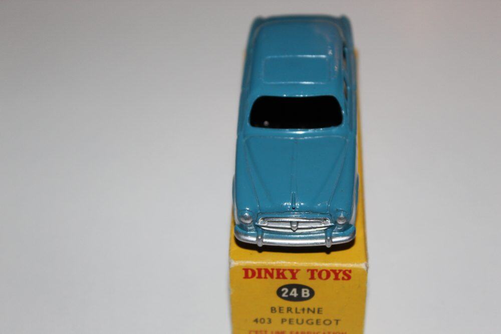 Vintage Dinky Toys 24B Peugeot 403 Berline model car on original box.