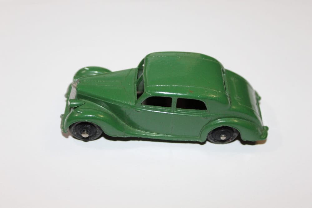 Vintage green Dinky Toys Riley Saloon diecast model car for collectors.