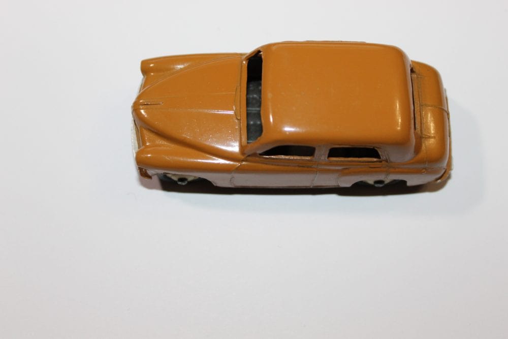Vintage Dinky Toys 24E Renault Dauphine diecast car on white background.