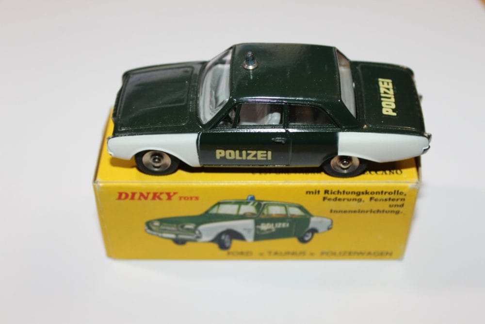 Vintage German Dinky Toys Ford Taunus police car model with Polizei markings.
