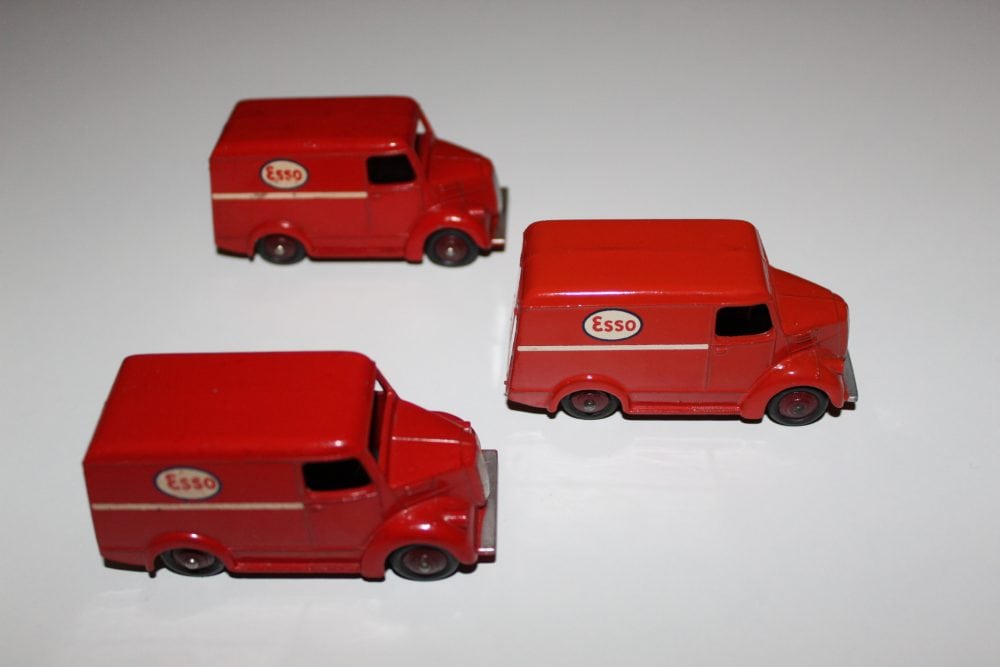 Miniature red diecast Trojan vans with 'ESSO' logo for collection.