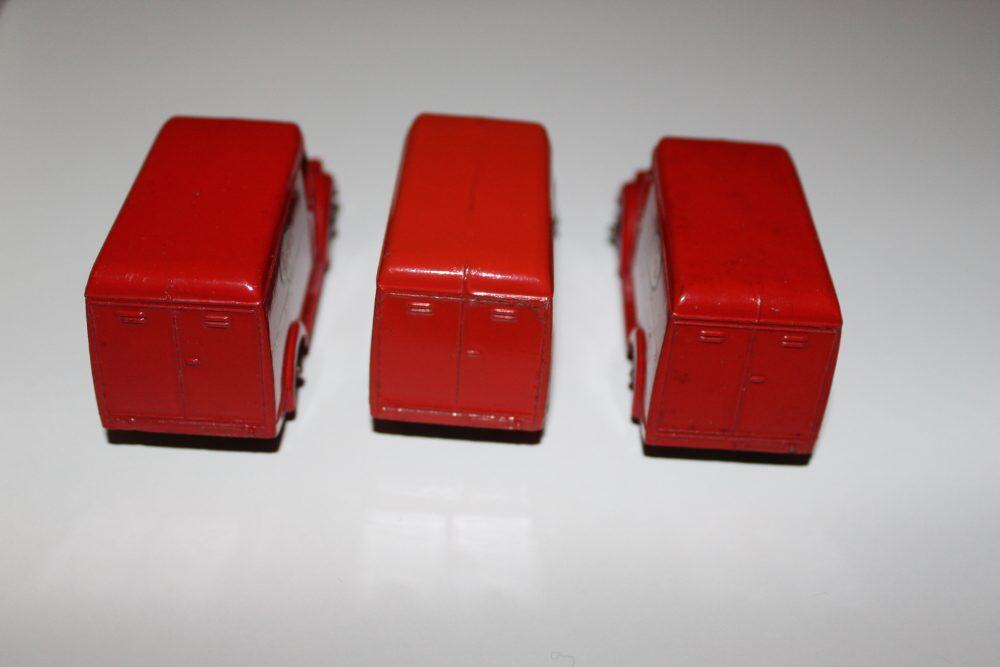 Three red Dinky Toys Trojan 'ESSO' Vans model in trade box for collection.