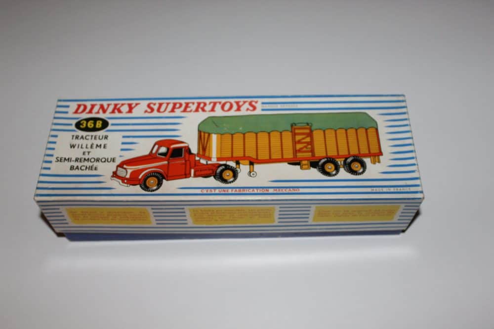 Detailed model of Dinky Willeme tractor with covered trailer for collectors.