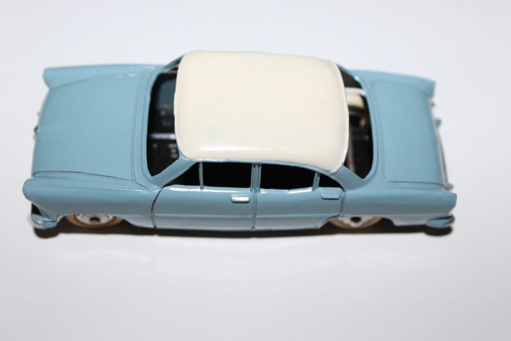 Vintage Dinky Toys Austin Healey 100 Tourer model in light blue and cream.