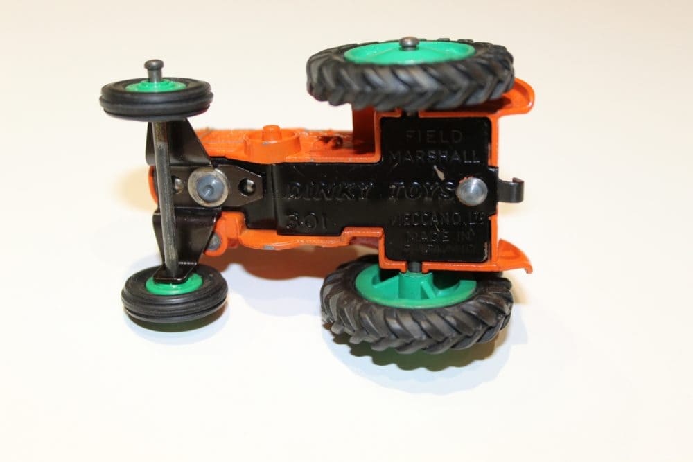 Vintage Dinky Toys Field Marshall tractor model for collectors.