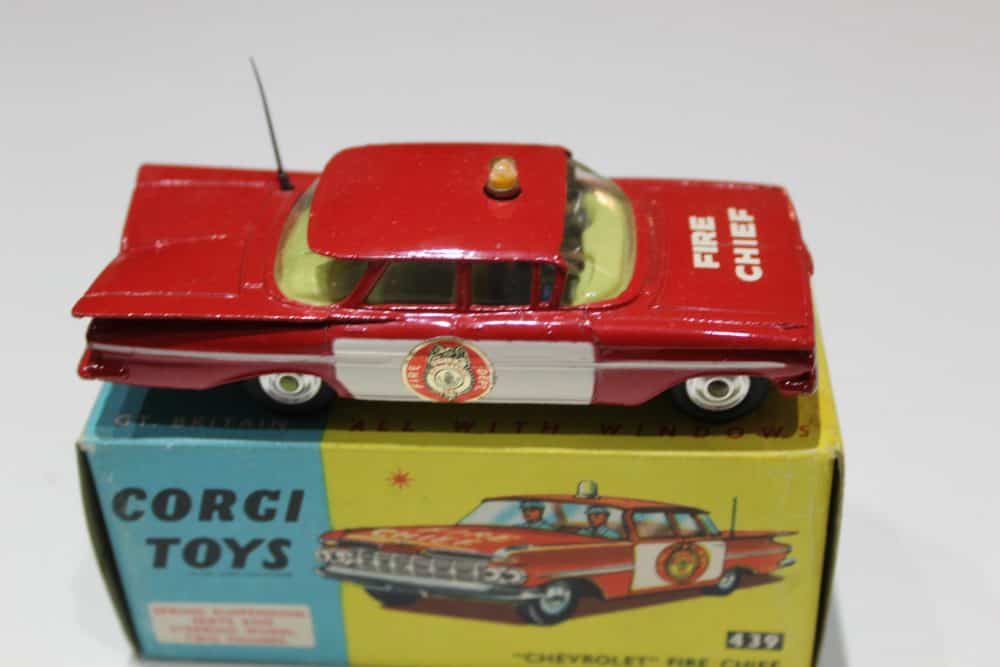 Vintage Corgi Toys Chevrolet Fire Chief Car model, red with fire department decals.