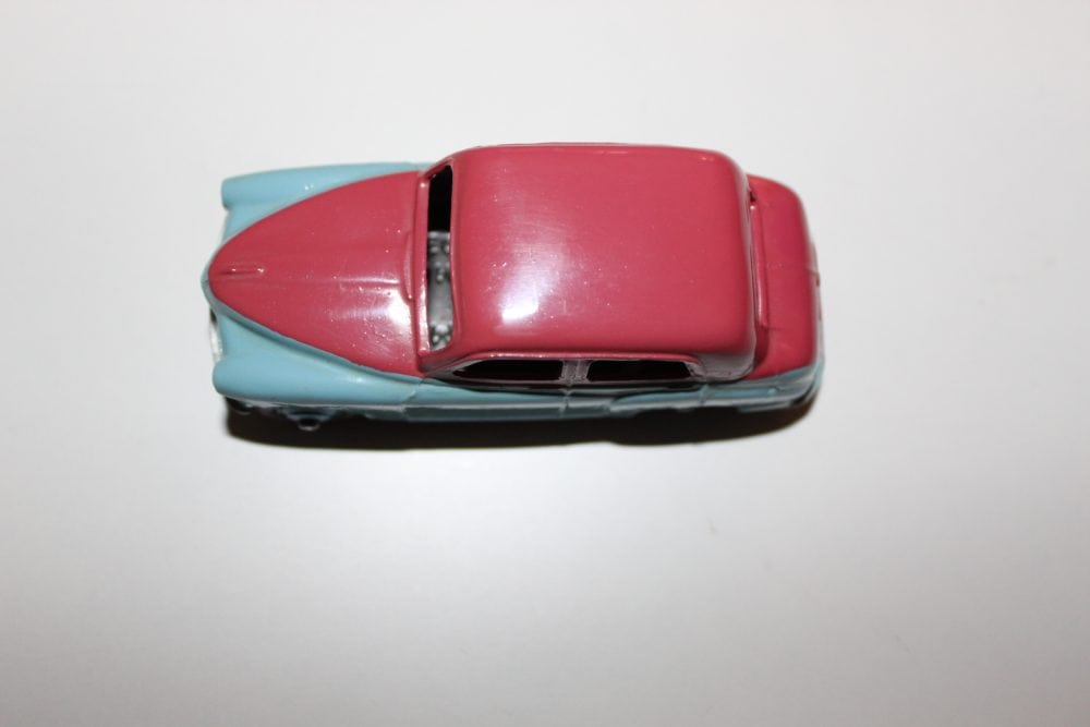 Vintage Dinky Toys 154 Hillman Minx diecast model car on white background.