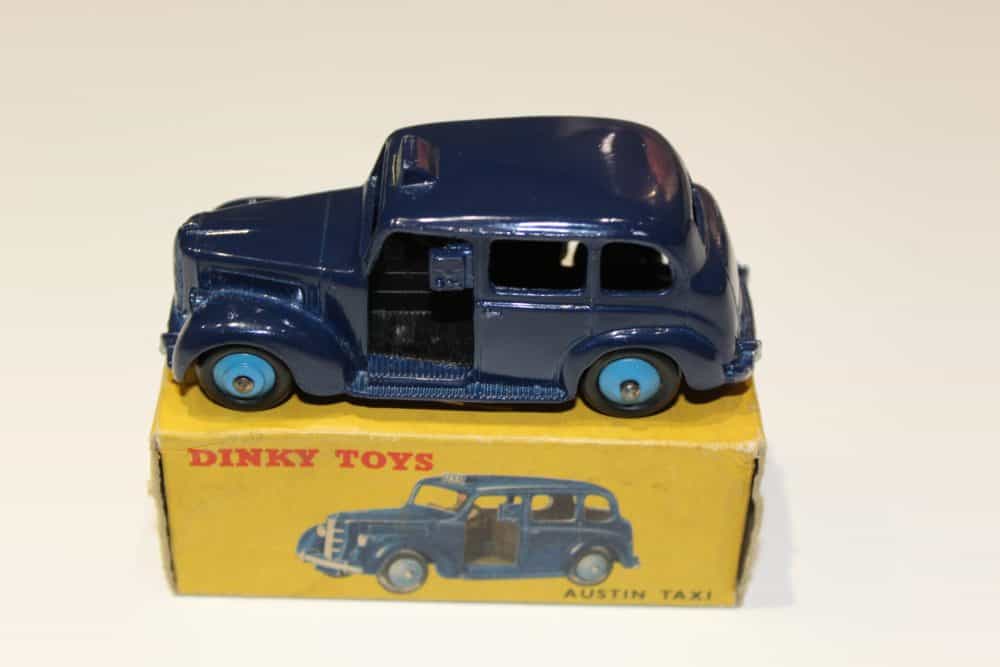 Vintage Dinky Toys Austin Taxi model in blue with yellow box.