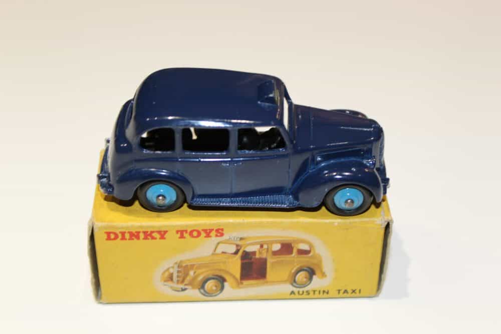 Vintage Dinky Toys Austin Taxi model in blue, with original box, collectible diecast car.