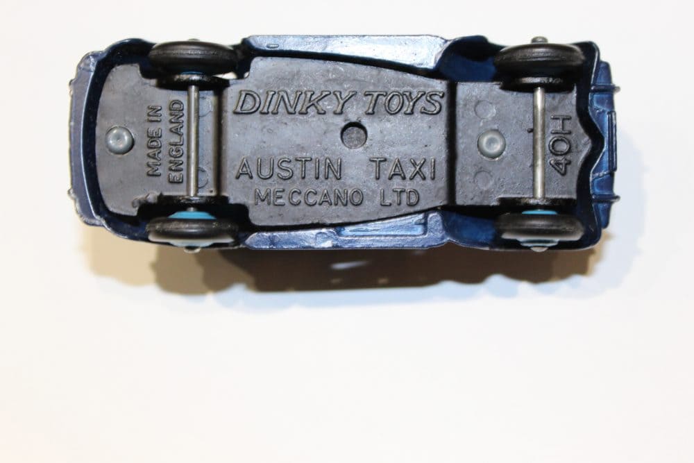 Detailed Dinky Toys Austin Taxi diecast model, vintage collectible item.