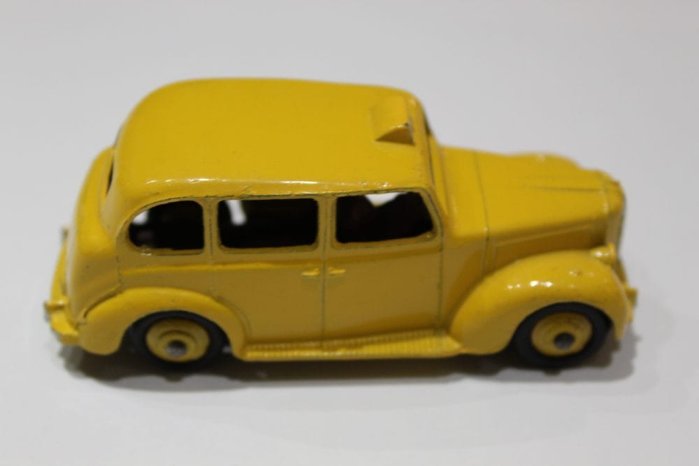 Vintage yellow Dinky Austin Taxi diecast model for collectors.