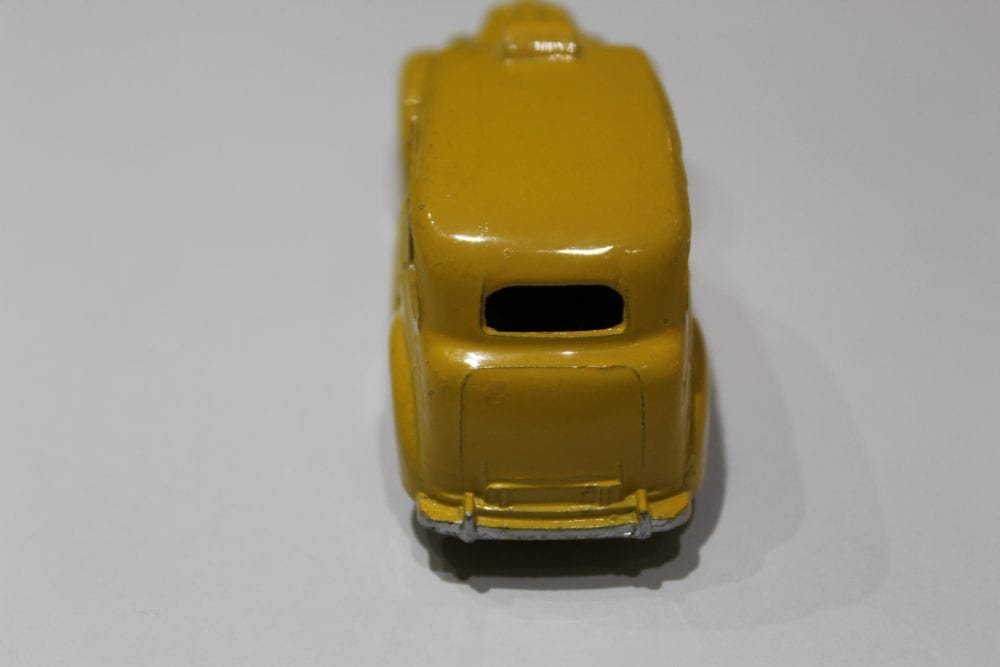 Vintage yellow Dinky Toys Austin Taxi diecast model for collectors.