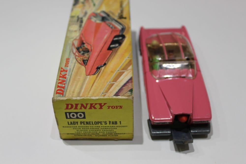 Vintage pink diecast model of Lady Penelope's FAB 1 car from Dinky Toys, with original box.