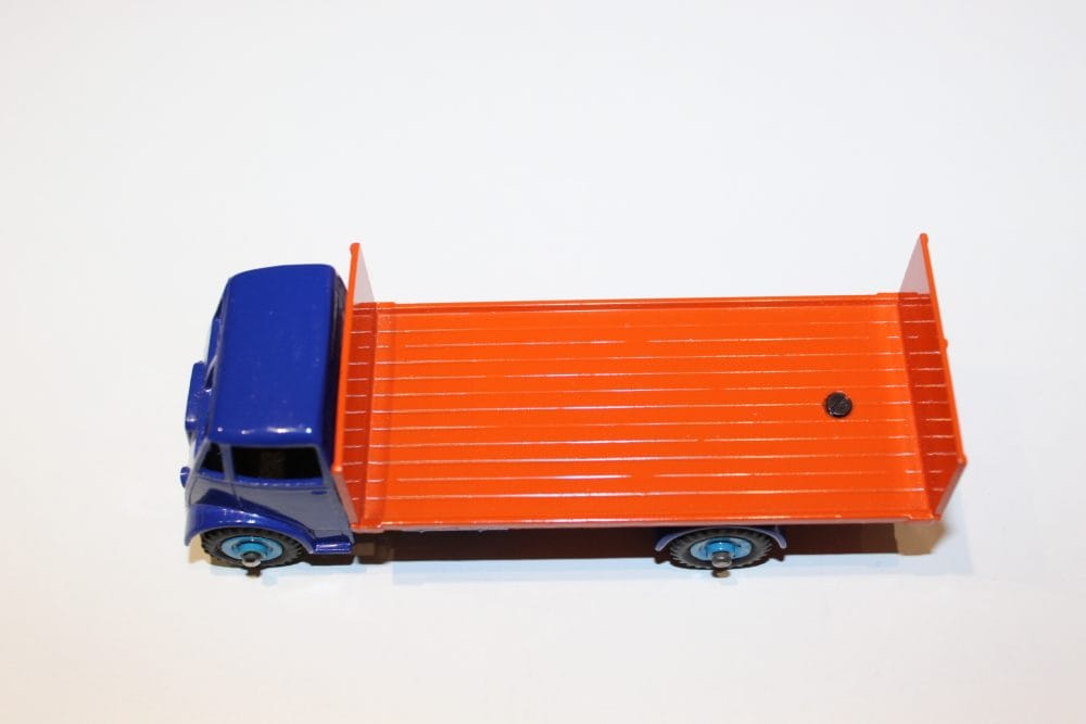 Dinky Toys 433/513 Guy tailboard lorry with blue cab and orange flatbed, vintage diecast model.