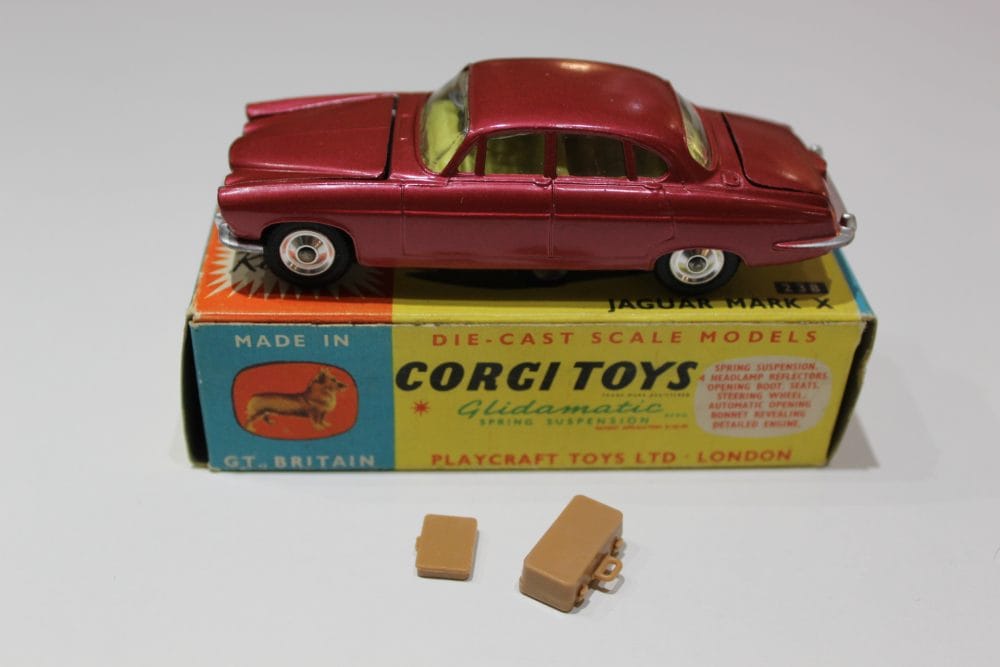 Vintage Corgi Toys 238 Jaguar Mark 10 die-cast model with accessories.