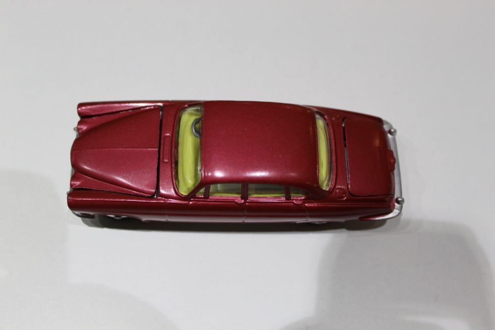 Detailed model of Corgi Toys 238 Jaguar Mark 10 in red with yellow interior.